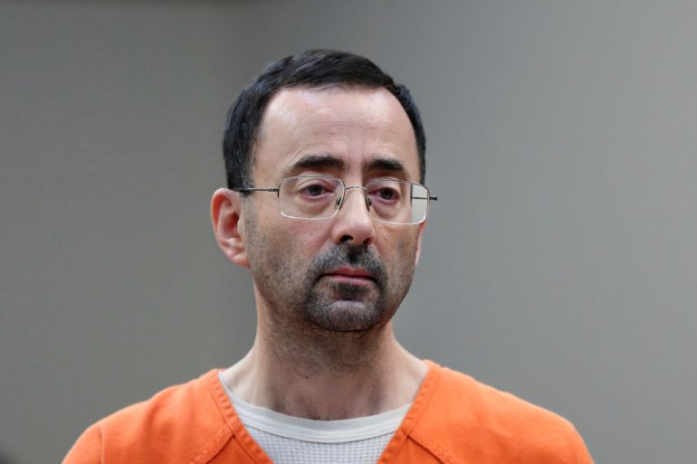 Larry Nassar in an orange jumpsuit