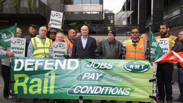 Rail, Maritime and Transport unio<em></em>n general secretary Mick Lynch (centre) joins members of his unio<em></em>n on the picket line outside Euston train station, London, during their long-running dispute over pay. Picture date: Friday June 2, 2023. PA Photo. See PA story INDUSTRY Strikes. Photo credit should read: Lucy North/PA Wire