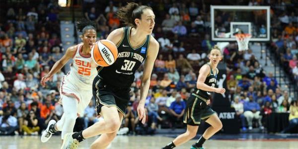 Breanna Stewart dribbles