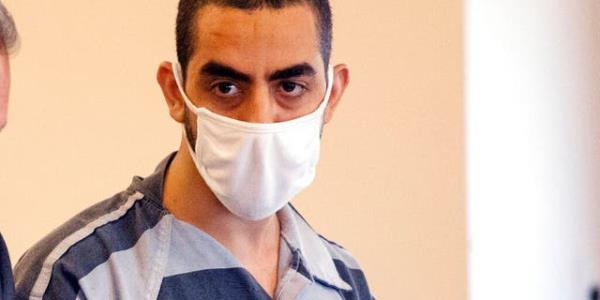 Salman Rusdhie stabbing suspect Hadi Matar in court wearing black and white jumpsuit