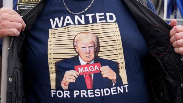 A supporter of ex-president Do<em></em>nald Trump outside court in Washington D.C.