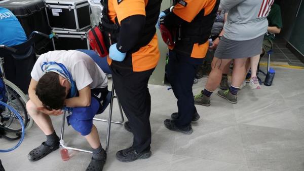 A participant waits at Jamboree Hospital during the 25th World Scout Jamboree in Buan, South Korea, August 4, 2023. REUTERS/Kim Hong-Ji
