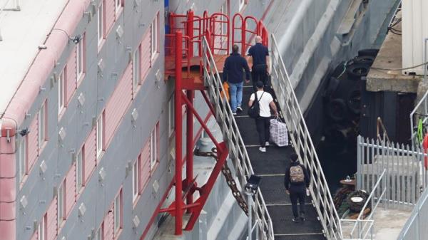 People boarding the Bibby Stockholm accommodation barge at Portland Port in Dorset. The Home Office have said around 50 asylum seekers would board the ship, with the numbers rising to its maximum capacity over the coming months, despite safety co<em></em>ncerns raised by some of the county&#39;s Co<em></em>nservative MPs and locals. Picture date: Mo<em></em>nday August 7, 2023.