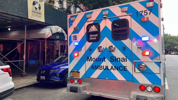 Investigators cordon off an apartment building in New York City’s Upper West Side