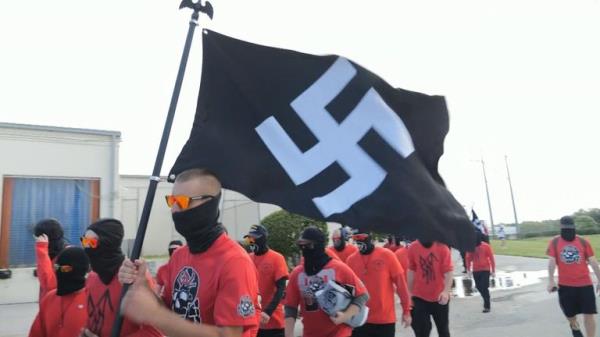 On a motorway overpass, on the edge of Orlando, there was a gathering of around 50 neo-Nazis. They were members of two anti-Semitic, white natio<em></em>nalist groups - "Blood Tribe" and the "Goyim Defense League."