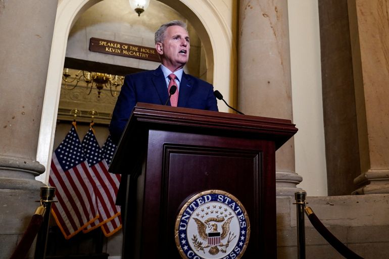 US House Speaker Kevin McCarthy speaks at a podium