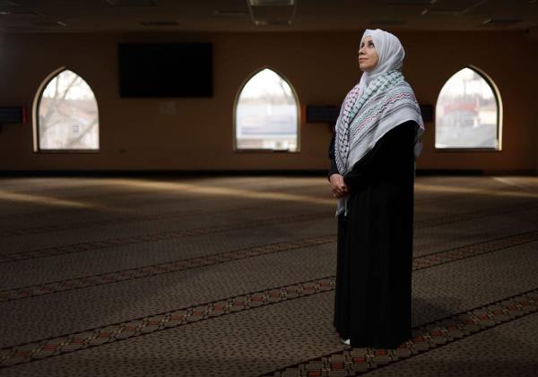 Deanna Othman stands inside the women’s prayer area at the Mosque Foundation in Bridgeview on Nov. 22, 2023. Othman is a high school English teacher at Universal School.