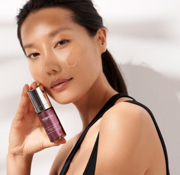 Picture of young female model holding 111SKIN product