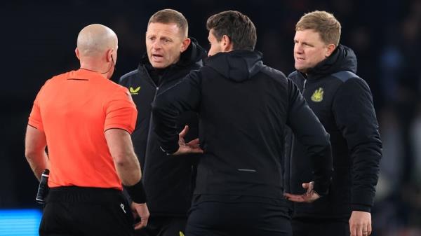 Eddie Howe (R) and his coaching staff co<em></em>nfront referee Szymon Marciniak after Newcastle's co<em></em>ntroversial draw at Paris Saint-Germain