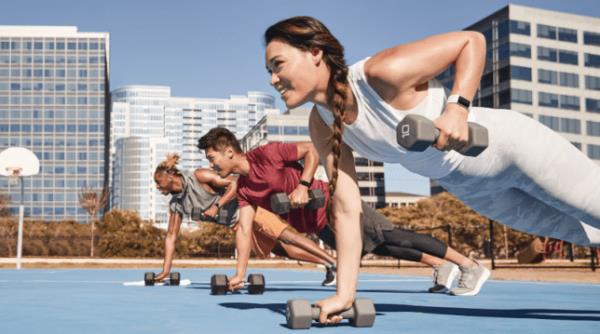 Woman exercising wearing a Fitbit