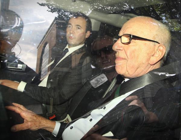 News Corp. Chairman Rupert Murdoch (R) rides with News Internatio<em></em>nal General Manager Will Lewis