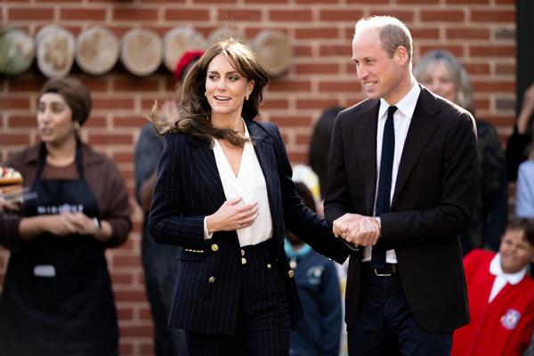 Prince William and Princess Catherine holding hands during their visit to the Grange Pavilion in Cardiff, Wales, UK, to celebrate the 75th anniversary of the HMT Empire Windrush arrival