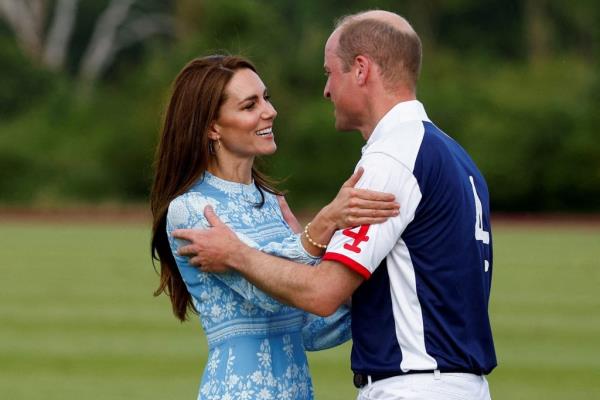 Prince William and Catherine, Duchess of Cambridge, embracing at the Royal Charity Polo Cup event in Windsor, Britain