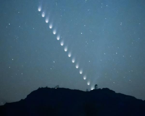 Comet burst: Diago<em></em>nal of multiple shots of a comet heading toward the horizon.