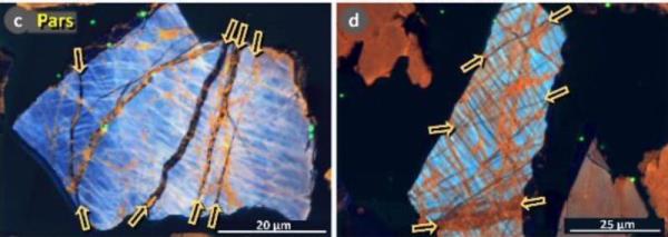 Multicolored crystals on black background with yellow arrows highlighting details. Younger Dryas comet