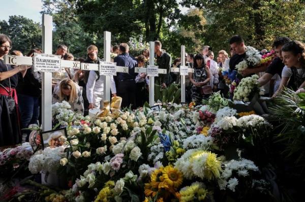 People attend a funeral ceremony for Yevhenia Bazylevych and her three daughters, killed during the Russian missile attack on September 4 as Yaroslav her husband, was the o<em></em>nly survivor out of the entire family, amid Russia's attack on Ukraine, in Lviv, Ukraine September 6, 2024. REUTERS/Roman Baluk TPX IMAGES OF THE DAY