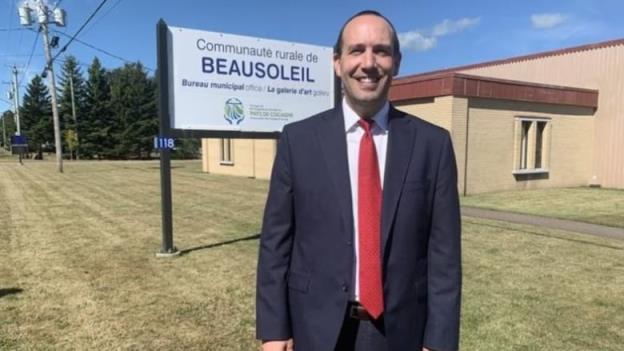 Mathieu Caissie stands outside the Beausoleil municipal office.