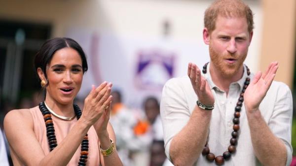 Pic: AP
Prince Harry and Meghan gesture as they visit children at the Lights Academy in Abuja, Nigeria, Friday, May 10, 2024.  Prince Harry and his wife Meghan have arrived in Nigeria to champion the Invictus Games, which he founded to aid the rehabilitation of wounded and sick servicemembers and veterans. (AP Photo/Sunday Alamba)