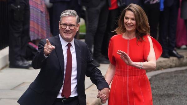 Newly elected Prime Minister Sir Keir Starmer, with his wife Victoria Starmer, greet wellwishers as he arrives at his official Lo<em></em>ndon residence at No 10 Downing Street for the first time after the Labour party won a landslide victory at the 2024 General Election. Picture date: Friday July 5, 2024.