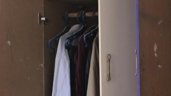 Clothes still hung in a wardrobe