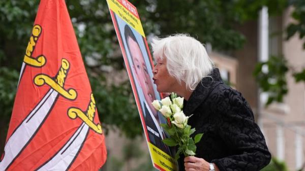 Melanie Leahy, whose 20-year-old son, Matthew, died in November 2012 while a patient at the Linden Centre mental health facility in Chelmsford, kisses a picture of him outside the Lampard Inquiry.
Pic: PA