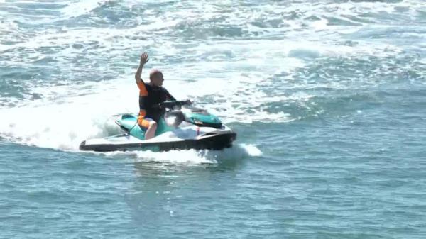 Ed Davey arrives at Liberal Democrat co<em></em>nference on a jet ski