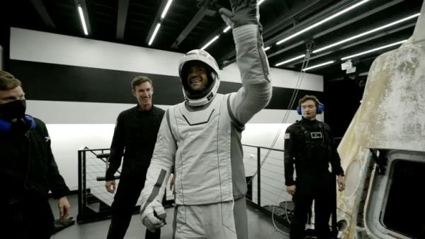 In this image made from SpaceX video, tech entrepreneur Jared Isaacman, center, reacts as he gets out of its capsule upon his return with his crew after the capsule landed in the Gulf of Mexico near Florida's Dry Tortugas early Sunday, Sept. 15, 2024. (SpaceX via AP)