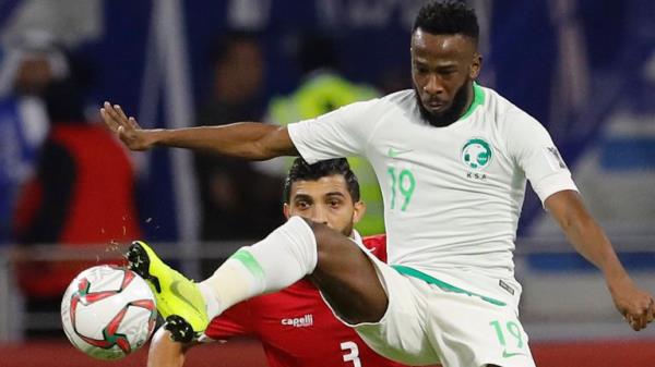 Saudi Arabia's forward Fahad Al Muwallad, foreground, controls the ball against Lebanon's defender Moataz Bellah al Juna, background, during the AFC Asian Cup group E soccer match between Lebanon and Saudi Arabia at Al Maktoum Stadium in Dubai, United Arab Emirates, Saturday, Jan. 12, 2019. (AP Photo/Hassan Mammar, file)