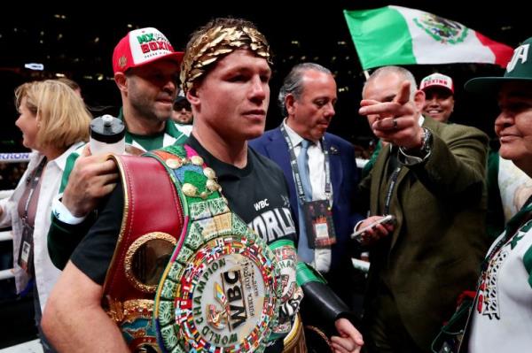 Saul 'Canelo' Alvarez celebrates after winning his super middleweight fight against John Ryder