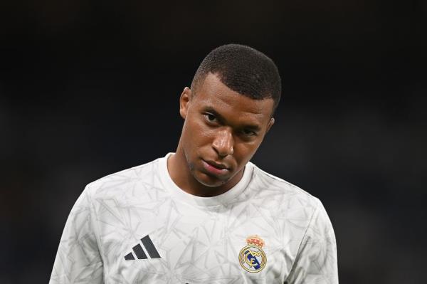 MADRID, SPAIN - SEPTEMBER 01: Kylian Mbappe of Real Madrid looks on during his warm up prior to the LaLiga match between Real Madrid CF and Real Betis Balompie at Estadio Santiago Bernabeu on September 01, 2024 in Madrid, Spain. (Photo by Denis Doyle/Getty Images)