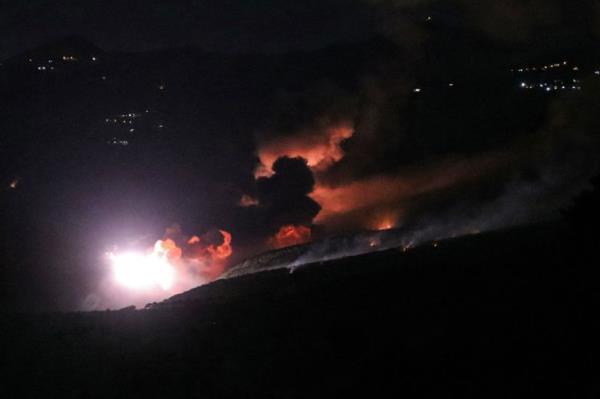 Smoke and fire rise from the site of an Israeli strike on the southern Lebanese border village of Mahmoudiyeh on September 19, 2024 