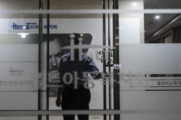 A man stands at the entrance to Holt Children’s Services building in Seoul, May 24, 2024. (AP Photo/Jae C. Hong)