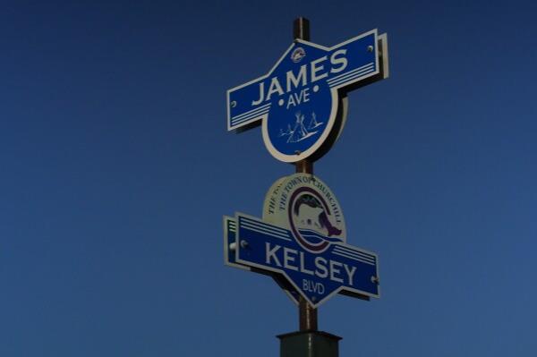 Street signs featuring a polar bear and Indigenous tipis stand on a street corner, Tuesday, Aug. 6, 2024, in Churchill, Manitoba. (AP Photo/Joshua A. Bickel)