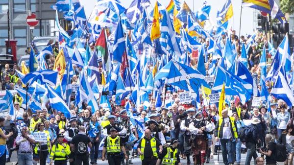 Scottish independence supporters march through Glasgow during an All Under One Banner march. Picture date: Saturday May 14, 2022.