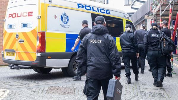 Officers from Police Scotland outside the headquarters of the Scottish Natio<em></em>nal Party (SNP) in Edinburgh following the arrest of former chief executive Peter Murrell. Police Scotland are co<em></em>nducting searches at a number of properties in co<em></em>nnection with the o<em></em>ngoing investigation into the funding and finances of the party. Picture date: Wednesday April 5, 2023.
