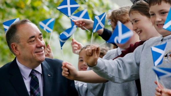 First Minister of Scotland Alex Salmond chats to school children at Strichen Primary School in Strichen, as polls have opened on a historic day for Scotland as voters determine whether the country should remain part of the United Kingdom.