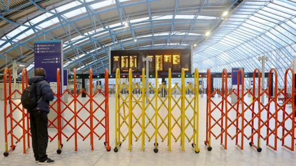 A commuter stands at a closed platform during the morning rush hour as a fresh wave of rail strikes by train drivers begins, at Waterloo Station.
Pic: Reuters