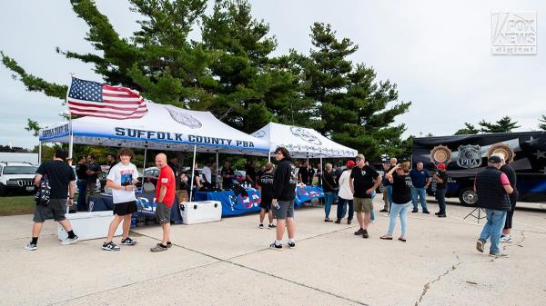 Members of the Suffolk County PBA attend a tailgate ahead of former President Do<em></em>nald Trump’s rally in Unio<em></em>ndale, New York