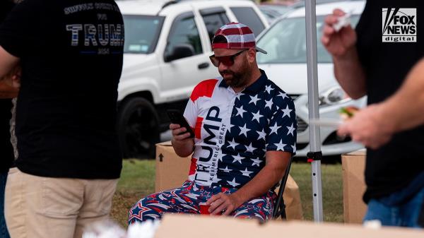 Members of the Suffolk County PBA attend a tailgate ahead of former President Do<em></em>nald Trump’s rally in Unio<em></em>ndale, New York