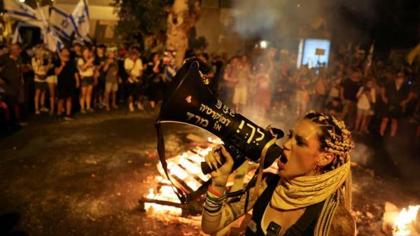 Protesters call for a ceasefire and hostage release deal during huge rally in Tel Aviv