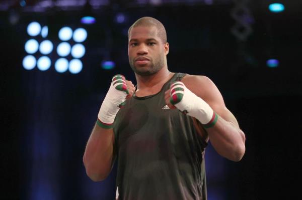 FILE - Britain's Daniel Dubois poses for the cameras after taking part in a boxing workout at the BT Sport studios, QEII Olympic Park in London, Tuesday, Nov. 29, 2022. Heavyweight champion Oleksandr Usyk is set to defend his WBA, WBO and IBF belts against Daniel Dubois this August in Poland, wher<em></em>e the Ukrainian fighter will have plenty of home support. Usyk announced Thursday, July 6, 2023, that he’ll face Dubois, a Briton who is the WBA mandatory challenger, on Aug. 26 at Tarczynski Arena. (AP Photo/Ian Walton, File)