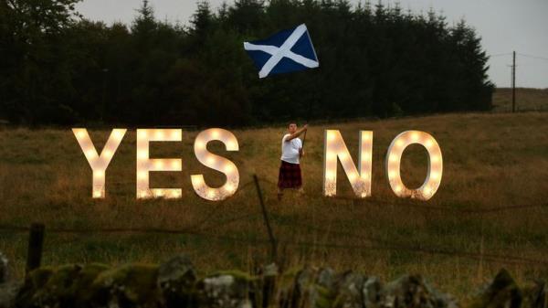 Previously unreleased photo dated 15/09/14 of businessman Jon Gamble from go2eventhire as he asks the question YES or NO with illuminated signs near Dunblane, Scotland, ahead of voting in the Scottish Referendum on September 18th.