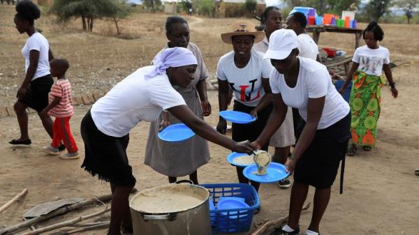 A woman serves traditio<em></em>nal porridge in the Mudzi district of Zimbabwe during the drought. Pic: Reuters