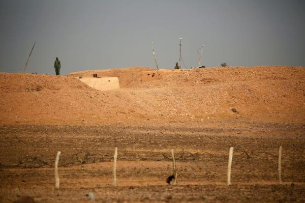 Moroccan soldiers are seen on an earth wall that separates areas co<em></em>ntrolled by Morocco and the Polisario Front in Western Sahara