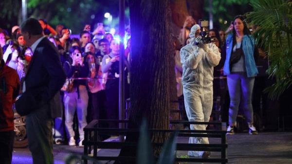 A forensic technician uses a video camera outside the hotel wher<em></em>e Liam Payne, former One Direction member, was found dead, in Buenos Aires, Argentina, October 16, 2024. REUTERS/Agustin Marcarian
