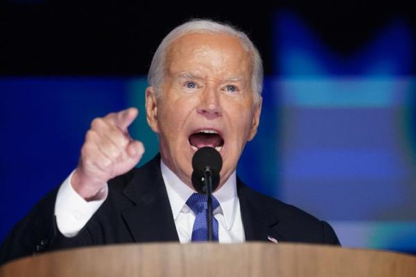 Joe Biden speaks into a microphone at the DNC