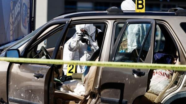 A forensic inspector uses a camera at the site following, what the Health Ministry says was an Israeli strike on a car, near the Christian-majority town of Jounieh, north of Beirut, Lebanon October 19, 2024. REUTERS/Yara Nardi
