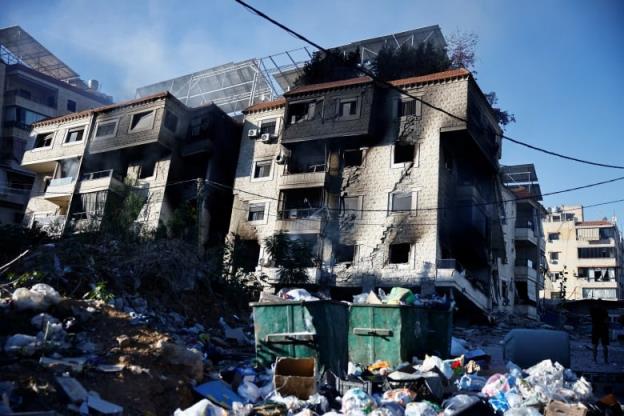 Multi-storey buildings, with blackened windows, after airstrikes.