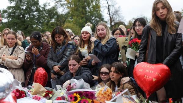 Mourners become tearful in Hyde Park on Sunday. Pic: Reuters