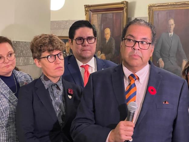 Picture of Naheed Nenshi with three NDP MLAs. 